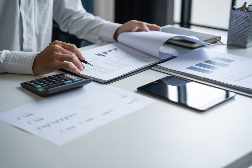 Person working with financial documents